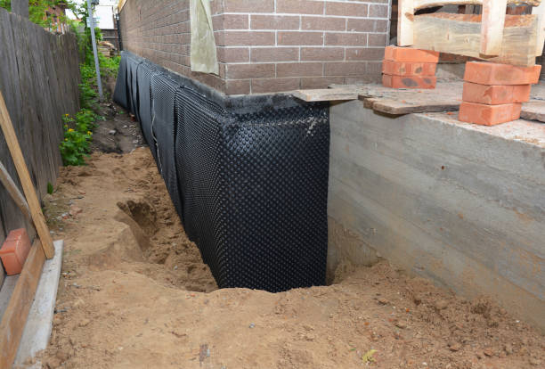 SJ Waterproofing Pros technician performing targeted Waterproofing assessment in National Park, NJ